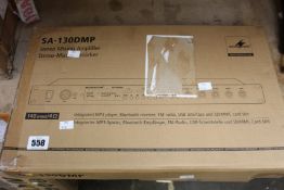 A boxed as new Monacor SA-130DMP stereo mixing amplifier.