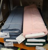 Six ten metre rolls of fabric in various colours.