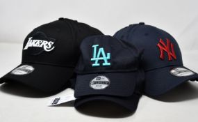 Twelve assorted as new New Era baseball caps (2 infants, 10 regular).