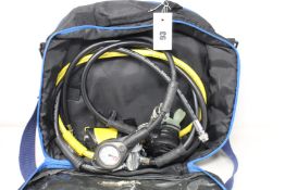 A pre-owned Apeks ATX diving regulator with carry bag.
