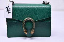 An as new Gucci Dionysus small handbag in emerald with dust bag (RRP £1,600).