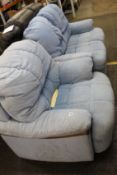 A blue two seater sofa together with an arm chair.