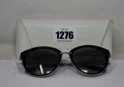 A pair of as new Michael Kors sunglasses.