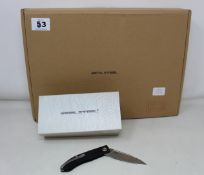 Twelve boxed Reel Steel Stella folding knives (Over 18s 0nly).
