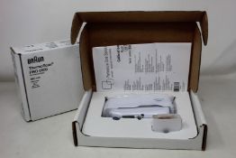 A boxed as new Welch Allyn Braun ThermoScan PRO 6000 ear thermometer with cradle.
