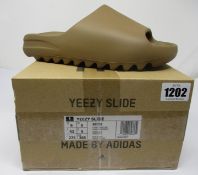 A pair of as new Adidas Yeezy Slide (UK 9).