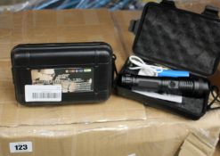 A box of Helius Zeta XO flashlight (Approximately 35 items).