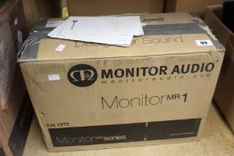 A pair of Monitor Audio MR 1 speakers in walnut.
