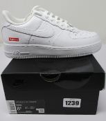 A pair of as new Nike Air Force 1 Low Supreme (UK 6).