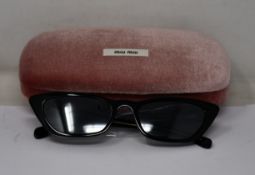 A pair of as new Miu Miu sunglasses.