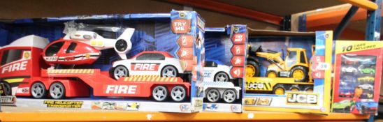 A JCB Heavy Load Transporter, a Police Helicopter Transporter, a Fire Helicopter Transporter and a