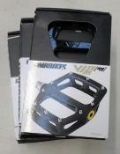 Four as new DMR Bikes V12 MG bike pedals in black.