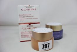 A Clarins rose radiance cream (50ml), a Clarins extra-firming jour (50ml), a Clarins multi-active