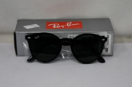A pair of as new Ray Ban Wayfarer sunglasses.