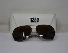 A pair of as new Michael Kors sunglasses.