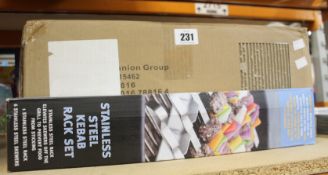 Eight Steven Raichlen Stainless Steel Kebab Rack Sets (With six stainless steel skewers).