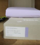 A Tekla 260 x 220cm cotton Percale double bedding set in lavender.