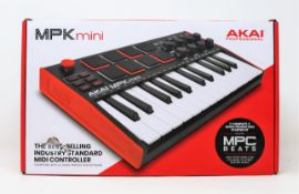 A boxed as new AKAI Professional MPK Mini 25 Key MIDI Controller (Box sealed, some damage to box).