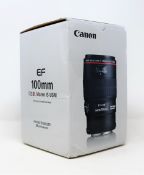 A boxed as new Canon EF 100 mm f2.8L Macro IS USM Lens (Box opened, some damage to box).