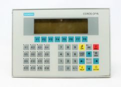 A pre-owned Siemens COROS OP15 Operator Panel (P/N: 6AV3515-1MA22-1AA0) (Untested, sold as seen).