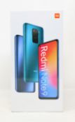 A boxed as new Xiaomi Redmi Note 9 128GB in Midnight Grey (Checkmend report: CM17642743-46A3C) (