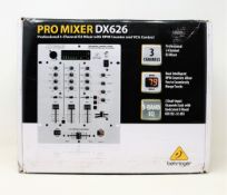 A boxed as new Behringer Pro Mixer DX626 3-channel DJ mixer (Box sealed, some damage to box).