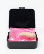 An as new Signia Contrast S+ Hearing Aid in Beige (REF: 10949268).