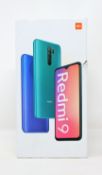 A pre-owned Xiaomi Redmi 9 64GB in Carbon Grey (FRP clear) (Box, UK plug, USB-C cable and case