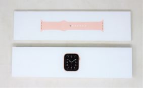 A pre-owned Apple Watch SE GPS(MYDN2B/A A2351) 40mm Gold Aluminium Case with Pink Sand Sport Band (