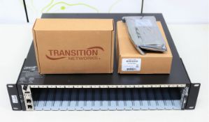 A box of Transition Networks networking equipment to include; 1x ION219-X 19 slot chassis, 16x