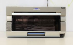 A pre-owned DNP DS40 photo printer (Some cosmetic damage).