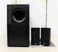 A Bose acousticmass 5 series III speaker system in black. (minor casing damage) (possibly pre-