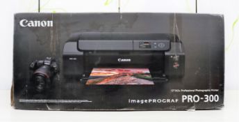 A boxed as new Canon ImagePrograf Pro-300 A3 professional photographic printer in black (PN: