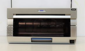A pre-owned DNP DS40 photo printer (Some cosmetic damage).