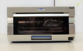 A pre-owned DNP DS40 photo printer (Some cosmetic damage).