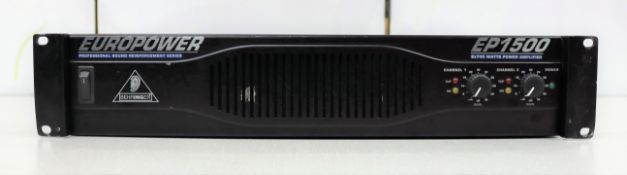 A pre-owned Behringer EP1500 power amplifier in black (Some cosmetic damage to casing).