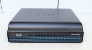 Two pre-owned Cisco 1941 Integrated Services Routers.