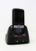 A pre-owned Honeywell Dolphin 60s Mobile Computer Barcode Scanner with cradle and power supply.
