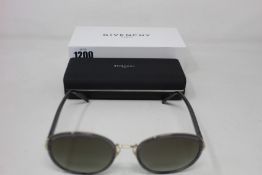 A pair of as new Givenchy sunglasses.