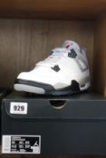 A pair of as new Nike Air Jordan IV G (UK 9).