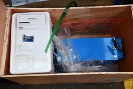 An unbranded wire stripping machine.