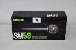 An as new Shure SM58 legendary vocal microphone.