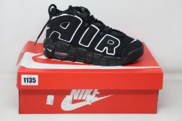 A pair of youths as new Nike Air More Uptempo (UK 5.5).