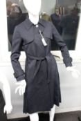 An as new Sandro long fastened coat in navy (EU 34 - RRP £475).