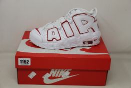 A pair of youths as new Nike Air More Uptempo (UK 4).