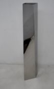An as new Alessi structural, mirror - polished stainless steel crevasse flower vase designed by