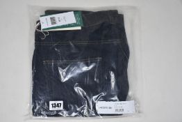 A pair of as new Lacoste jeans (W38/L32).