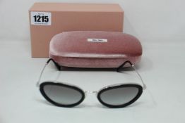 A pair of as new Miu Miu sunglasses.