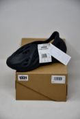 A pair of as new Adidas Foam Runner (UK 6).