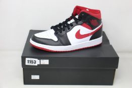 A pair of as new Nike Air Jordan 1 Mid (UK 6).